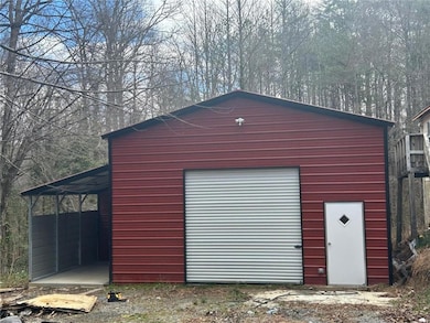 Garage with a detached garage and driveway