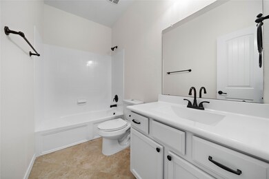 The home boasts three full baths. The hall bath has bold finishes and new plumbing fixtures.