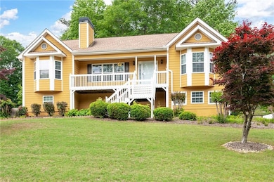 View of front of house featuring a porch, a chimne