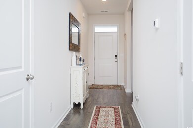 Interior space featuring dark wood-type flooring