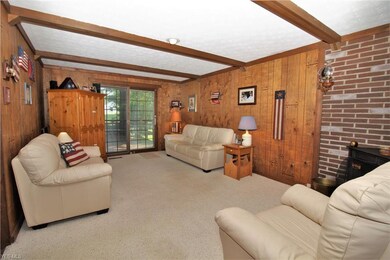 Family Room with Beamed Ceiling and Direct Access 