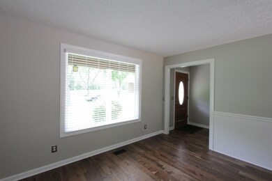 Front door with foyer and large living room.