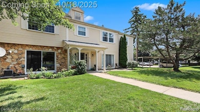 View of front of home featuring a front yard and stone siding