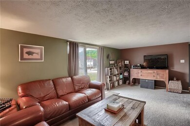 The family room is flooded with natural sunlight a