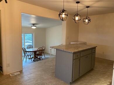 Kitchen overlooking sunroom