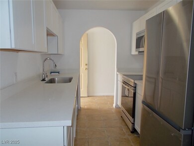 Kitchen featuring stainless steel appliances, whit
