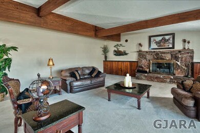 A large and gracious living room greets you from t