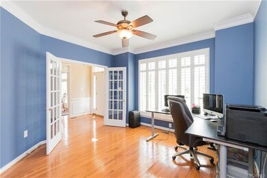 Office with French doors off foyer.