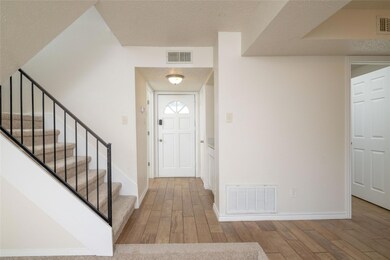 Standing in living room facing front door