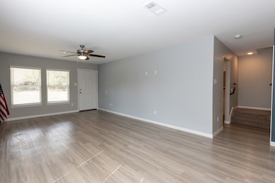 Light-filled living area with an open layout designed for comfort and every day living.