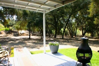 Looking out on oaks and towards front of property.