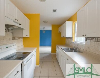 Kitchen. Cabinets for days is this bright and chee