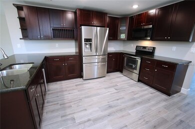 Gorgeous kitchen with all wood cabinets and breakf