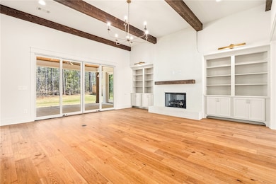 Living room with built ins and lighting