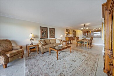 Sunlight floods this comfortable living - dining a