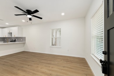 Just off the kitchen, the spacious living area off
