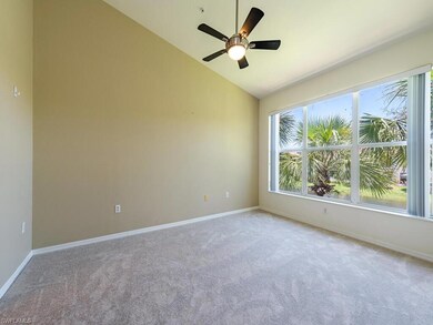Spare room with carpet, lofted ceiling, and ceilin
