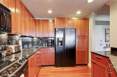 Cherry cabinets over Blue Polare granite tops