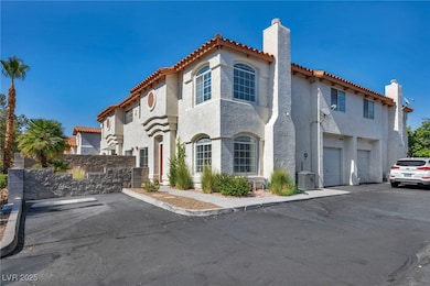 Mediterranean / spanish home featuring a chimney,