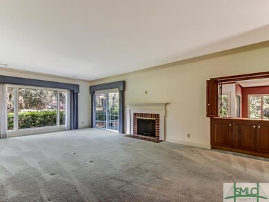 The living room has a wood burning fireplace and w