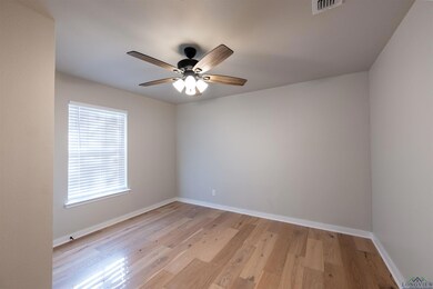 Unfurnished room featuring ceiling fan and light h