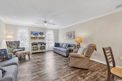 Living area featuring a textured ceiling, wood fin