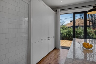 The wall pantry is beautifully designed with a sty