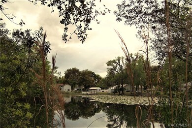 Looking from side road to water behind lot