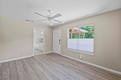 Spare room with light wood-style flooring, a ceil