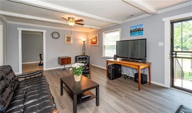 Family Room - Large family room with beamed ceilin