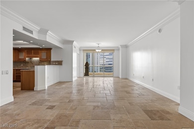 Unfurnished living room with stone tile floors, or