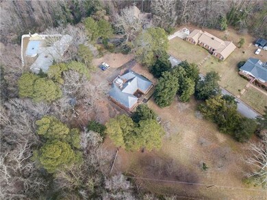 Aerial view of home situated on private 2.26 acre 