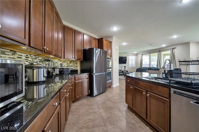 Kitchen featuring appliances with stainless steel