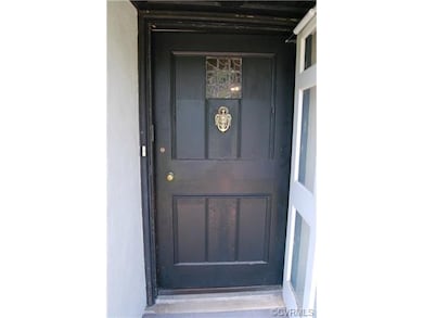 Original wood solid front door.