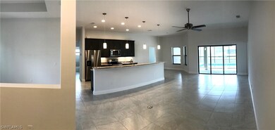 AS YOU ENTER 534 SE 1ST TER, GREAT ROOM WITH SLIDI
