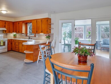 Side door entrance leads into the kitchen with a v