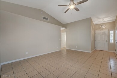 Spare room featuring light tile patterned floors,