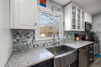 Kitchen with hanging light fixtures, appliances wi