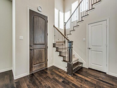 Entrance foyer with dark wood-type flooring