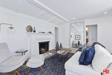 Formal living room w/two sided cozy fireplace