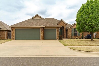 View of front of property featuring a garage and a