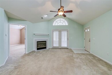 Vaulted ceilings & ceiling fan in the living room
