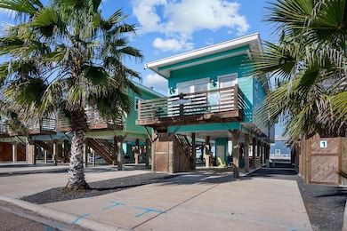 View of property with a carport and stairs