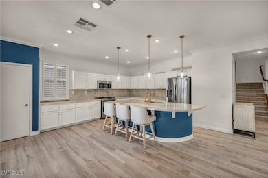 Kitchen with stainless steel appliances, ornamenta