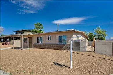 View of front of home with fence and a patio area