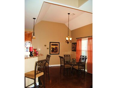 Breakfast Area. Stained Concrete Flooring. Vaulted