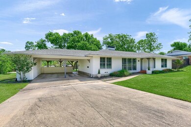 Single story home featuring 2 lots and a Double carport
