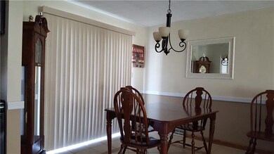 Dining room area sliding glass doors which lead to