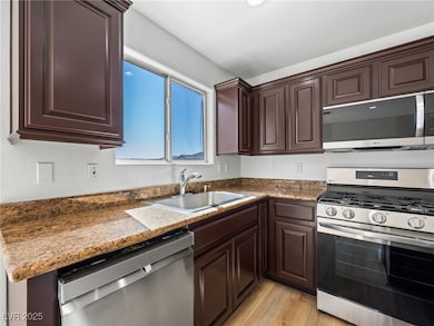 Kitchen featuring appliances with stainless steel