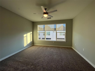 Unfurnished room with carpet and ceiling fan